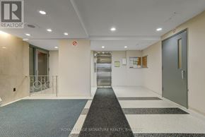 Toronto (Parkwoods-Donalda) condo for rent - A hallway with a Royal LePage Signature Realty logo on the wall.