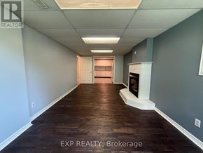 Bradford West Gwillimbury (Bradford) apartment for rent - A long hallway with wood floors and white walls.