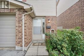 London South (South T) townhouse for rent - A house number 25 with a grey door and a small window.