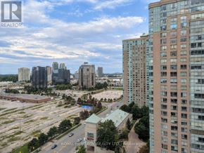 Toronto (Woburn) condo for rent - A cityscape with a mix of high-rise buildings and a parking lot.