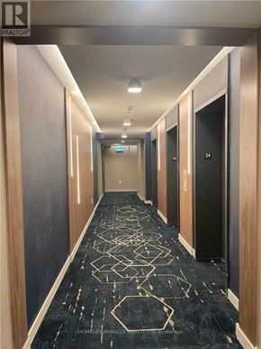 Toronto (Waterfront Communities) condo for rent - A hallway with doors numbered 54 and 54A.