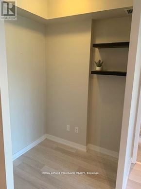 Toronto (Bayview Village) condo for rent - A small room with a shelf and a plant on it.