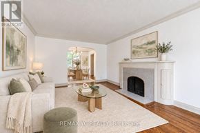 Toronto (Leaside) apartment for rent - A living room with a fireplace and a couch.