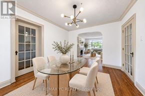Toronto (Leaside) apartment for rent - A dining room with a glass table and chairs.