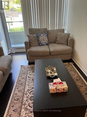 Toronto (Willowdale East) condo for rent - A living room with a couch, a coffee table, and a rug.