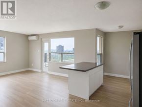 Toronto (Annex) condo for rent - A spacious room with a large island in the middle.