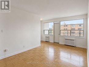 Toronto (Annex) condo for rent - A room with a window and a radiator on the floor.