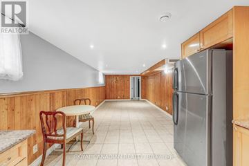 Toronto (West Hill) apartment for rent - A kitchen with a table and chairs in the middle of the room.