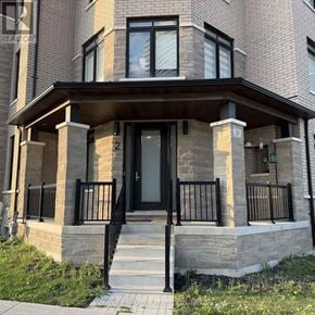 Brampton (Bram East) duplex for rent - A brown house with a black door and windows.