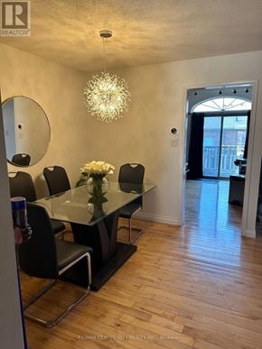 London North (North B) townhouse for rent - A dining room with a glass table and chairs.