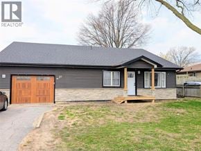 Windsor apartment for rent - A house with a grey roof and a brown garage door.