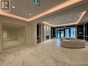Toronto (Humber Heights) condo for rent - A spacious lobby with marble floors and a green exit sign.