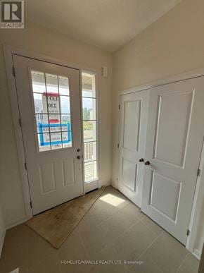 Loyalist (Bath) apartment for rent - A real estate listing photo of a room with white doors and a sign on the window.