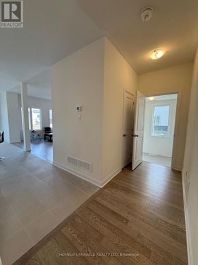Loyalist (Bath) apartment for rent - A spacious room with wooden flooring and white walls.