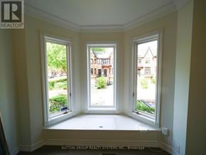 Toronto (Kensington-Chinatown) townhouse for rent - A room with two windows and a view of a street with houses.