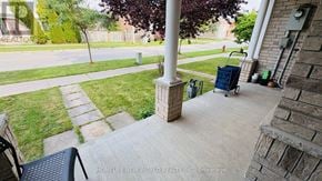 Richmond Hill (Rouge Woods) townhouse for rent - A porch with a pillar and a chair.