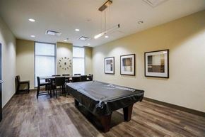 Surrey apartment for rent - A room with a trampoline in the middle of it.