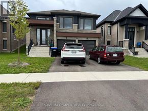 Wasaga Beach apartment for rent - A white car is parked in front of a house.