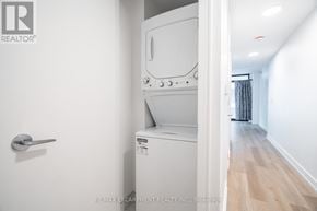 Hamilton (Beasley) condo for rent - A white oven and microwave in a kitchen.
