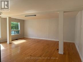 Georgina (Keswick South) apartment for rent - A room with wooden flooring and white walls, with a window on the left side.