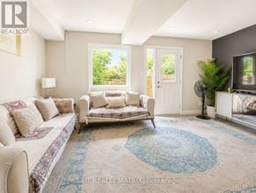 Ottawa townhouse for rent - A living room with a couch, a chair, and a rug.