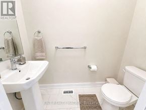 Russell townhouse for rent - A white bathroom with a sink, toilet and bathtub.