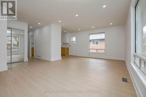 Toronto (Kingsview Village-The Westway) apartment for rent - A spacious room with wooden flooring and white walls, part of a property brokerage by Royal Star Realty Inc.
