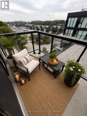 Burlington (Lasalle) condo for rent - A balcony with a chair, table, and plants.
