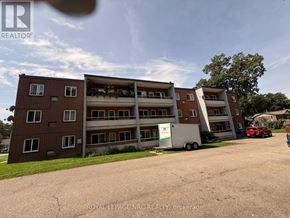 Niagara Falls (Dorchester) multi-family for rent - A large multi-story building with a red truck parked in front of it.