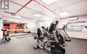 Toronto (Bedford Park-Nortown) townhouse for rent - A gym with a variety of equipment and motivational words on the wall.