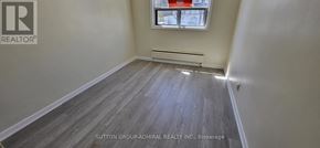 Toronto (Bedford Park-Nortown) apartment for rent - A room with a window and a radiator on the wall.
