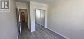 Toronto (Bedford Park-Nortown) apartment for rent - A room with a door and a glass door leading to another room.