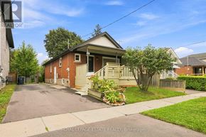 Toronto (Clairlea-Birchmount) apartment for rent - A house with a driveway in front of it.