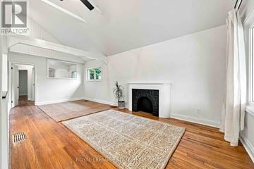 Toronto (Clairlea-Birchmount) apartment for rent - A living room with a fireplace and a rug on the floor.