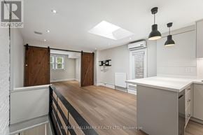Toronto (The Beaches) duplex for rent - A kitchen with a skylight and a white ceiling.