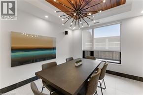 Burlington condo for rent - A modern dining room with a wooden table and chairs.