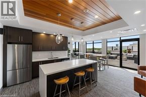 Burlington condo for rent - A modern kitchen with a large island and stainless steel appliances.