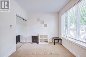 Markham (Commerce Valley) townhouse for rent - A room with a white wall and a window with blinds.