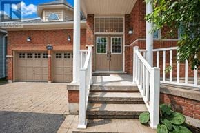 Barrie (Innis-Shore) apartment for rent - A house with a brick facade and a white porch.