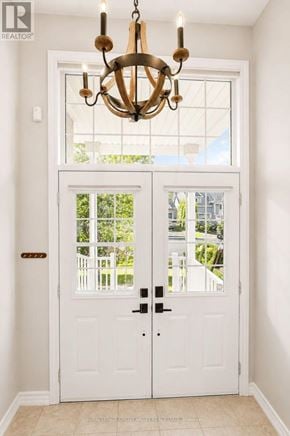 Barrie (Innis-Shore) apartment for rent - A white double door with a glass window and a chandelier hanging above it.