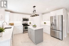 Barrie (Innis-Shore) apartment for rent - A modern kitchen with white cabinets and stainless steel appliances.