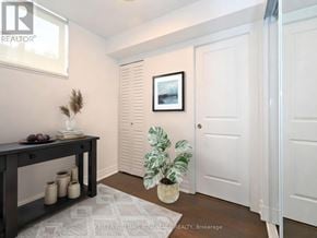 Toronto (Dovercourt-Wallace Emerson-Junction) townhouse for rent - A room with a table, vases, and a potted plant.