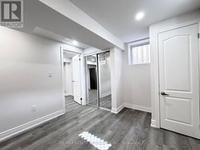 Milton (Be Beaty) apartment for rent - A room with a white door and a mirror on the wall.