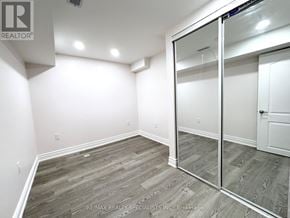 Milton (Be Beaty) apartment for rent - A room with a sliding glass door and wood flooring.