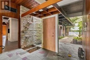 St. Catharines (Martindale Pond) apartment for rent - A wooden door is open to a stone wall.