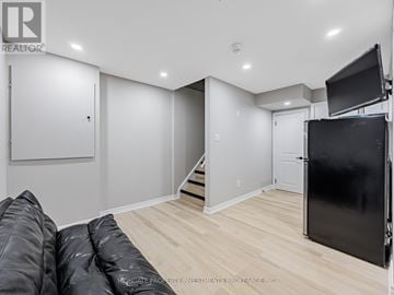 Ajax (Northeast Ajax) townhouse for rent - A living room with a couch and a television.
