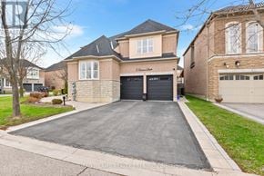 Ajax (Northeast Ajax) apartment for rent - A house with a driveway in front of it.