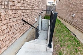 Ajax (Northeast Ajax) apartment for rent - A set of stairs with a black railing leading up to a door.