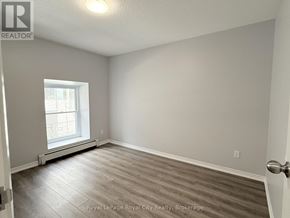 Guelph (Downtown) multi-family for rent - A room with a window and a door.