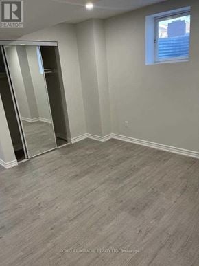 East Gwillimbury (Sharon) apartment for rent - A room with a grey floor and a large mirror on the wall.